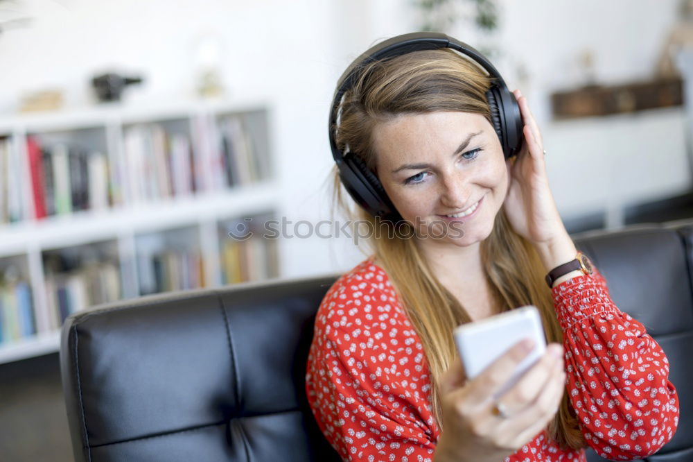 Image, Stock Photo Young blonde girl using a smartphone while sitting