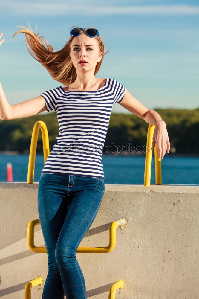 Similar – Woman barefoot sitting on roof of car