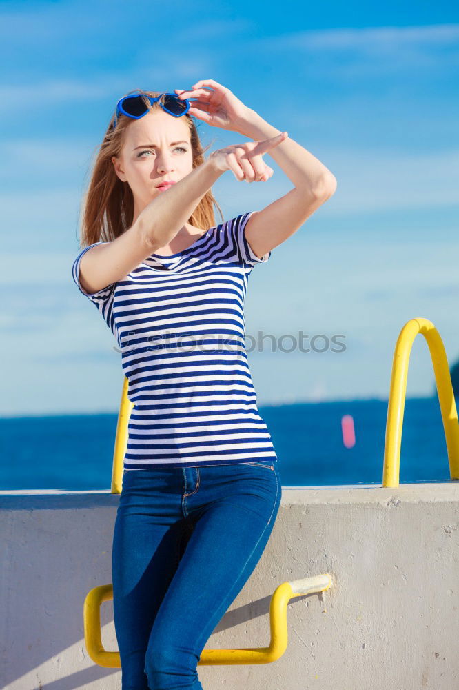 Similar – A beautiful young blonde woman stretching in a park