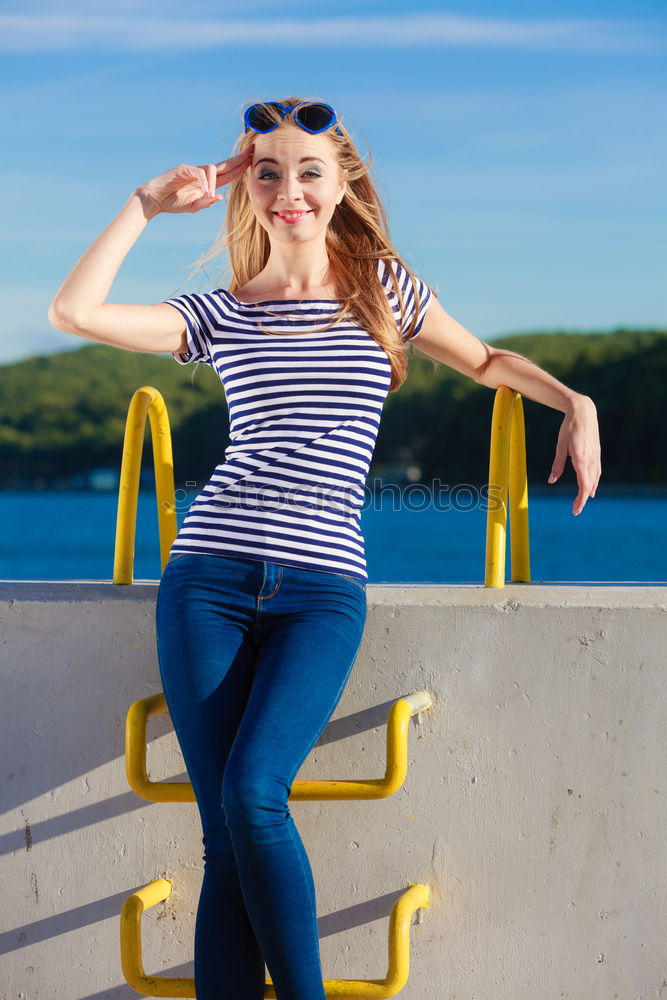 Similar – Woman barefoot sitting on roof of car