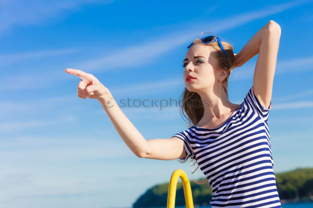 Similar – Woman barefoot sitting on roof of car