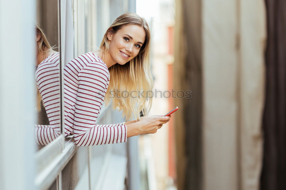 Similar – Blonde girl with red shirt enjoying life outdoors.