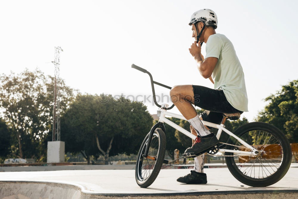 Similar – Image, Stock Photo Smiling man with sunglasses sitting at bicycle