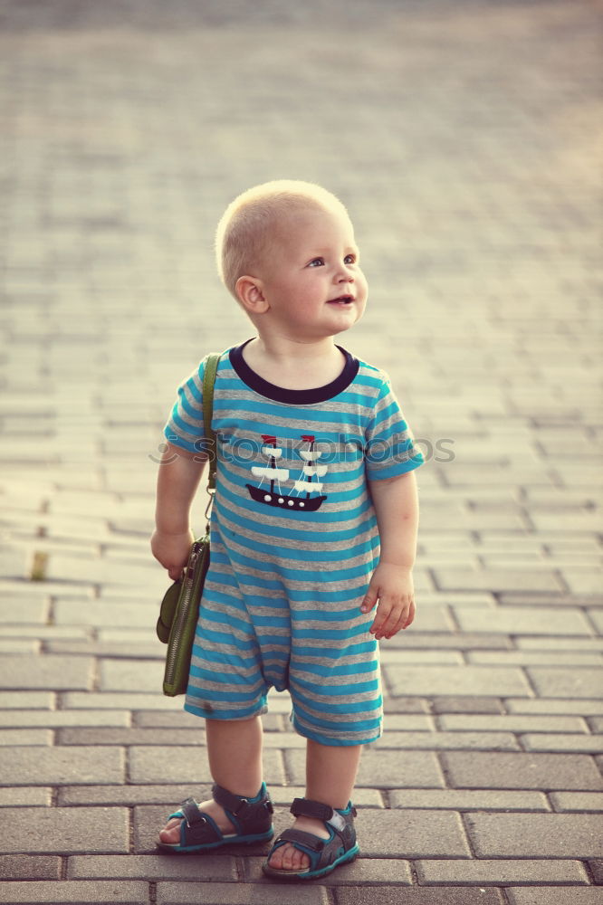 Similar – baby walking barefoot on stones