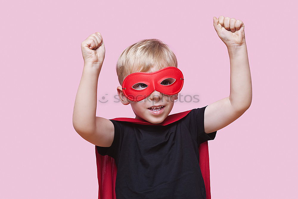 Similar – Happy little child playing superhero. Kid having fun outdoors. Concept of girl power.