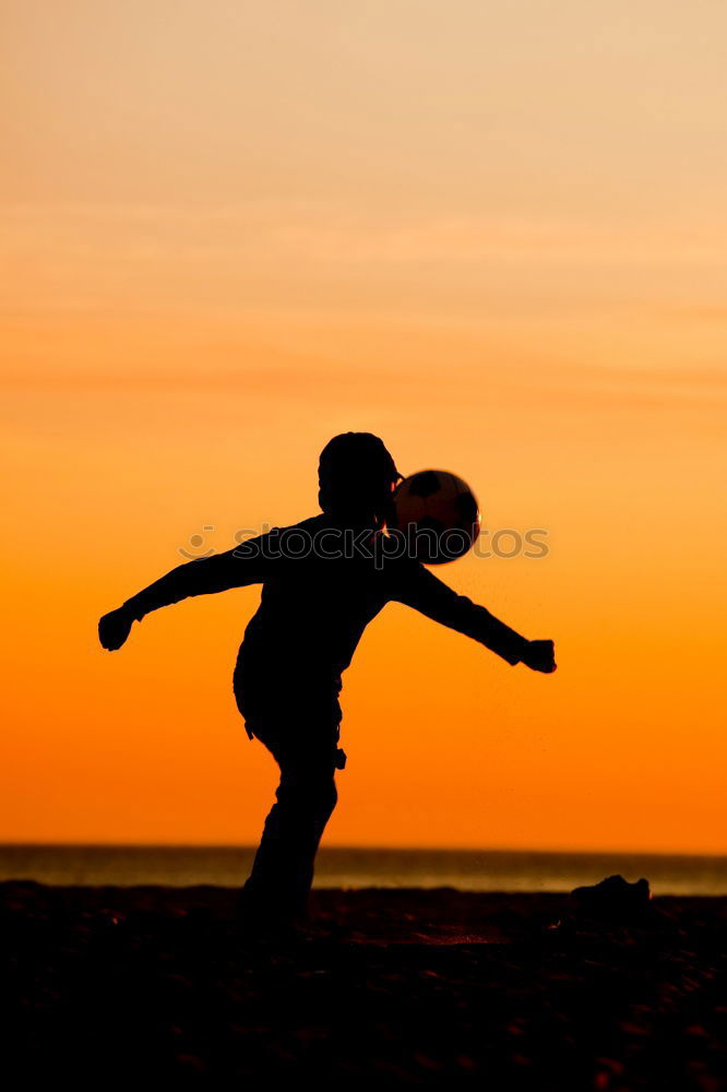 Similar – Father and son playing on the beach at the sunset time.