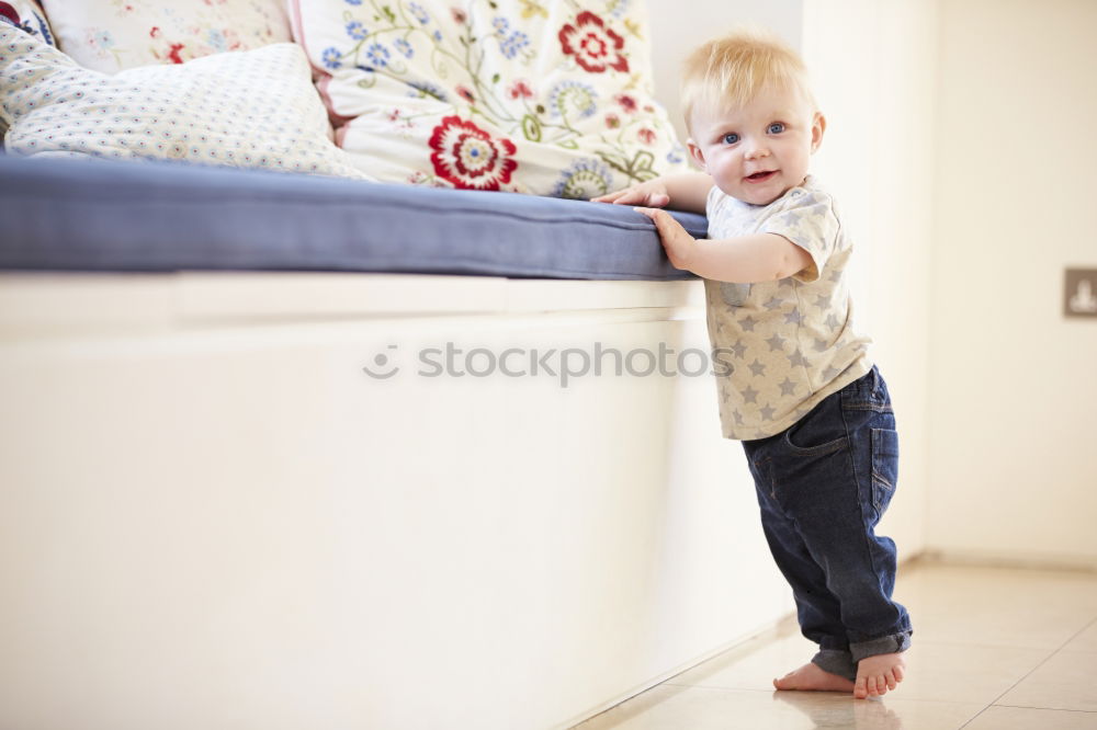 Similar – Image, Stock Photo Little boy sitting on the bed and smile