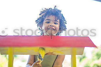 Similar – Young boy talking to the phone in a yellow telephone booth