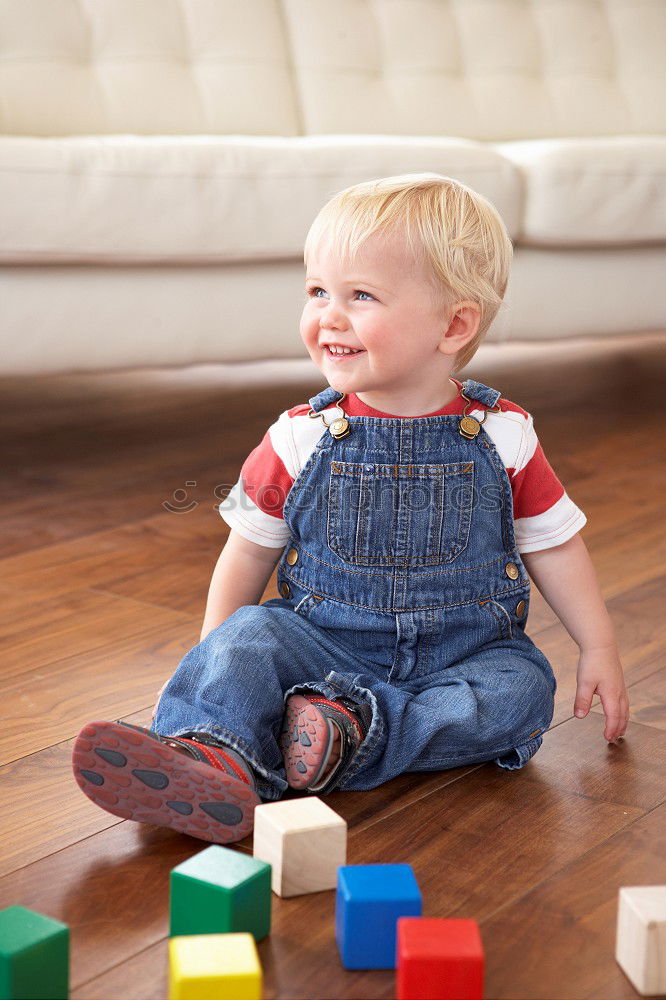 Similar – Toddler boy playing with new toy wearing pyjamas