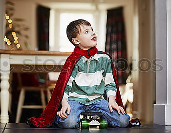 Similar – Toddler boy playing with new toy wearing pyjamas