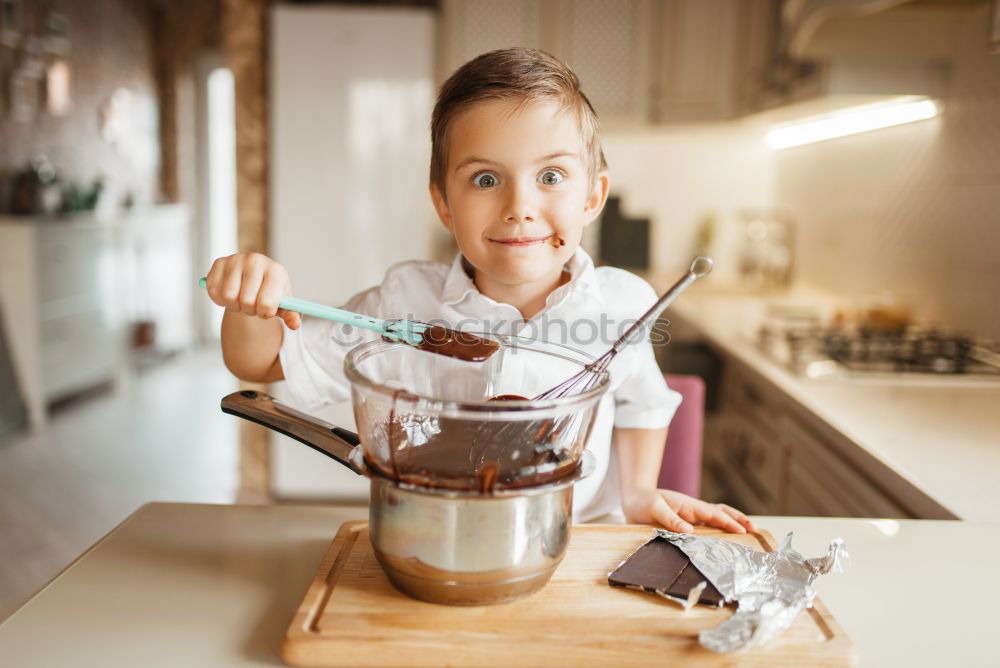 Similar – Image, Stock Photo Portrait of little girl preparing baking cookies.