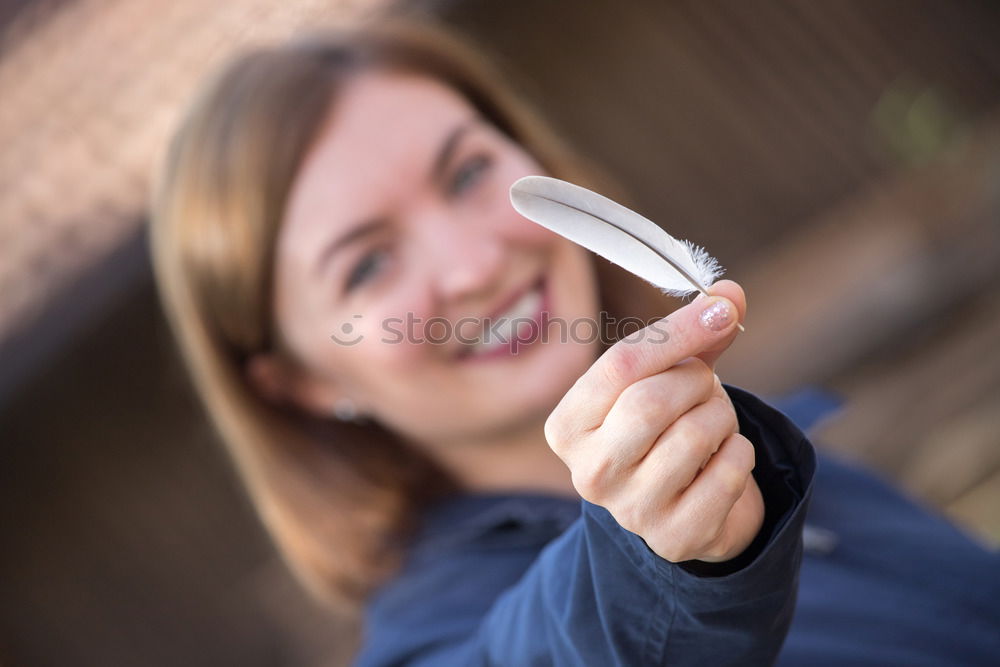 Similar – woman covering her eye with piece of sushi