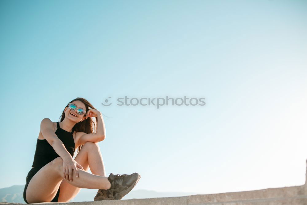 Similar – Brunette woman on a lifeguard tower