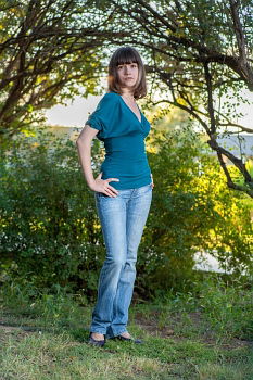 Similar – Redhead woman smelling a flower in a park