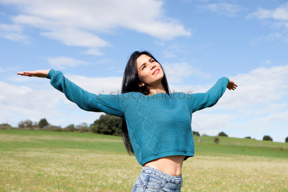 Similar – Women wearing t-shirt and jeans stays outdoor in the park