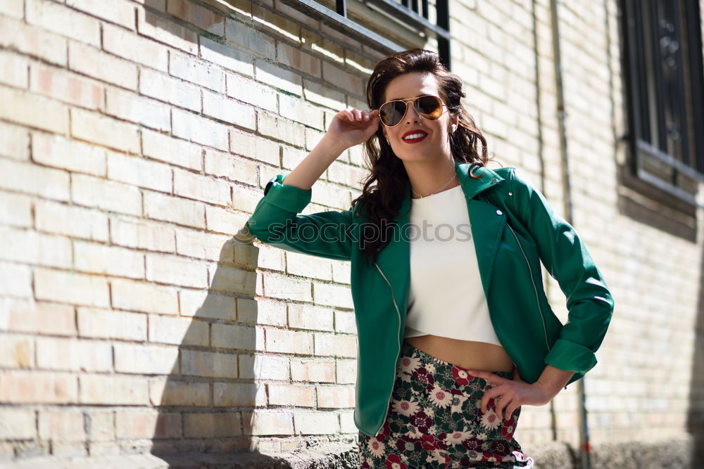 Similar – Image, Stock Photo Woman with aviator sunglasses next to a brick wall