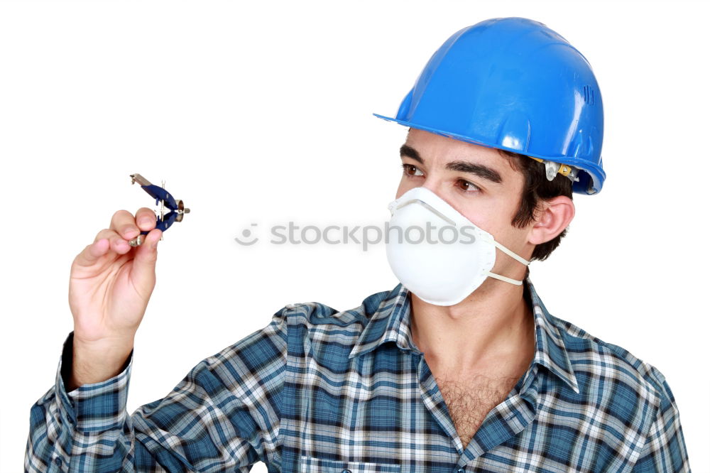 Similar – Workman in protective mask and glasses standing on street