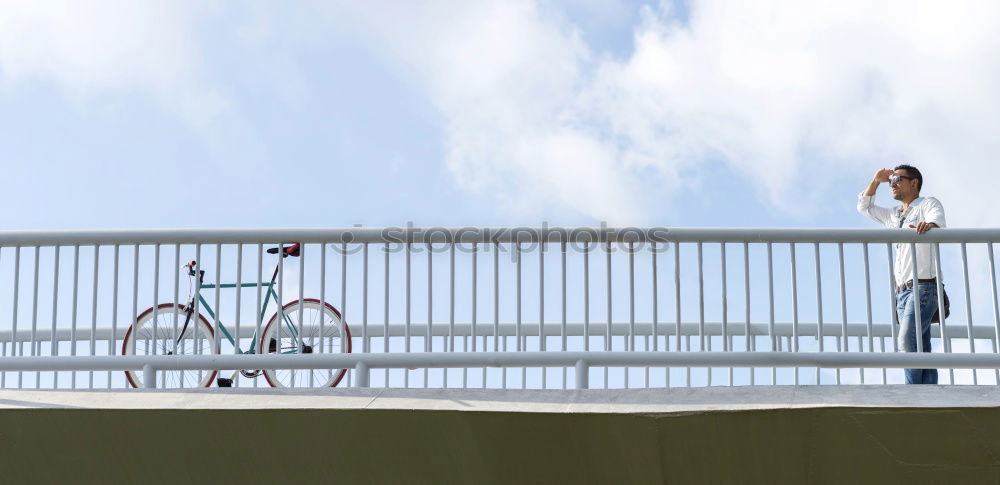 Similar – Young fitness woman runner running on city bridge.