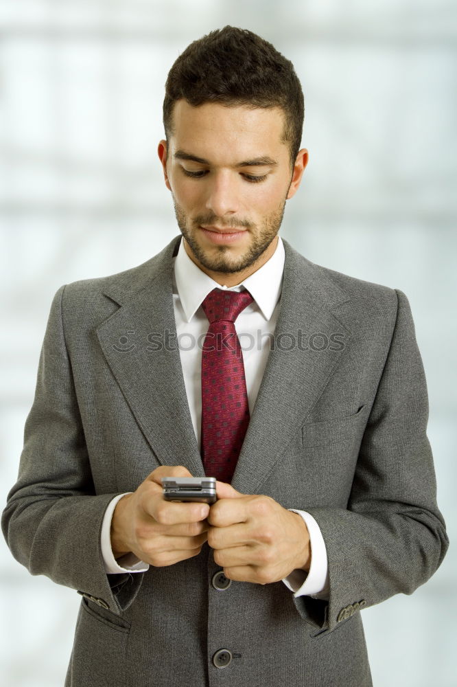 Similar – Image, Stock Photo Businessman Texting on his Phone in the Street