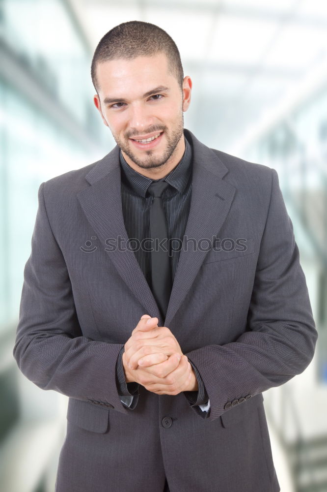 Serious attractive businessman walking down an urban street