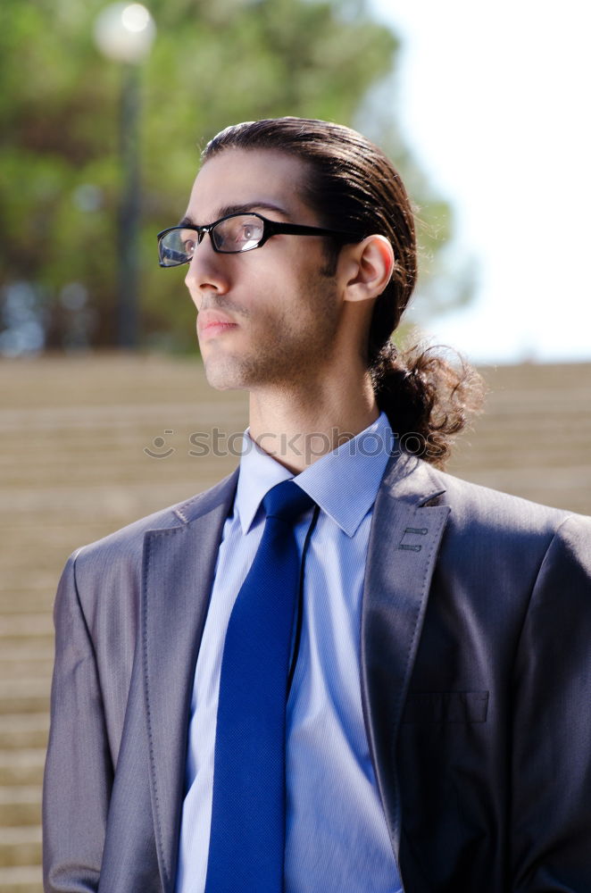 Similar – Image, Stock Photo Portrait of a stylish young handsome long-haired unshaven man