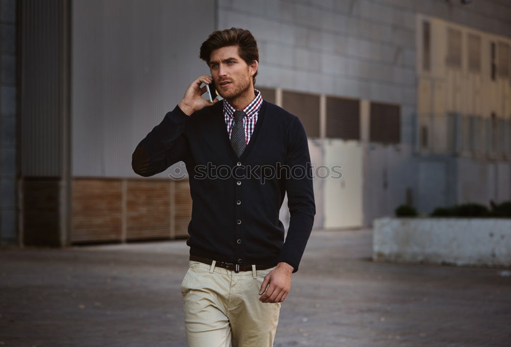 Similar – Young bearded man, model of fashion, sitting on urban step