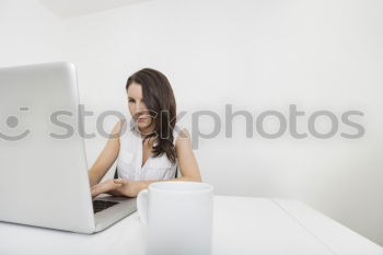 Similar – Image, Stock Photo brunette woman is using her computer while having a coffee