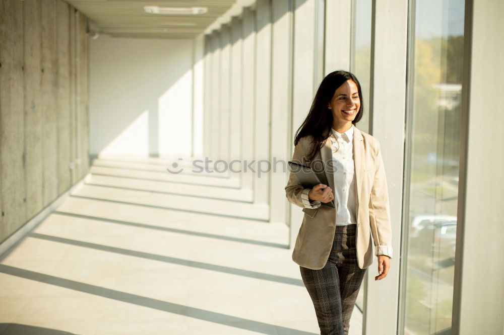 Similar – Stylish woman in jacket talking phone