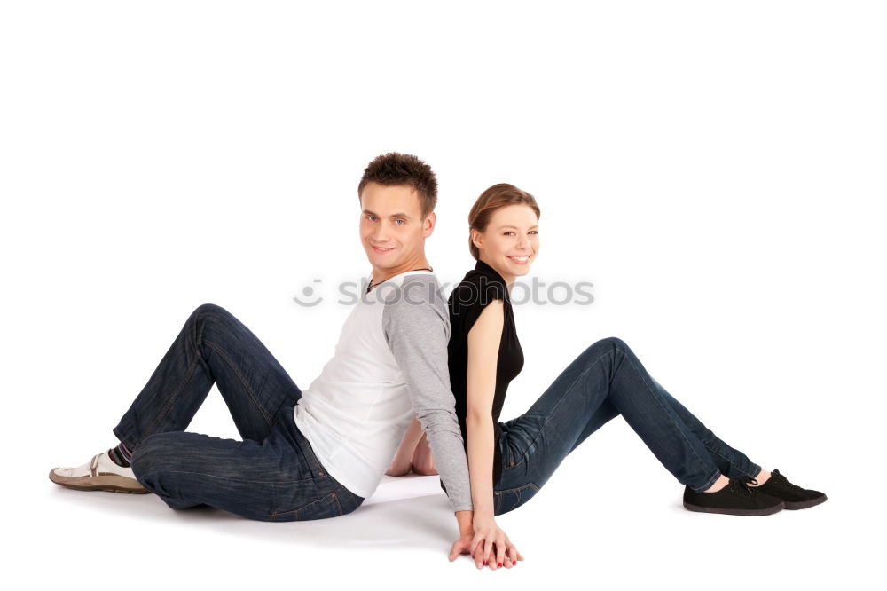 Similar – Side view Happy couple in love jumping against grey wall.