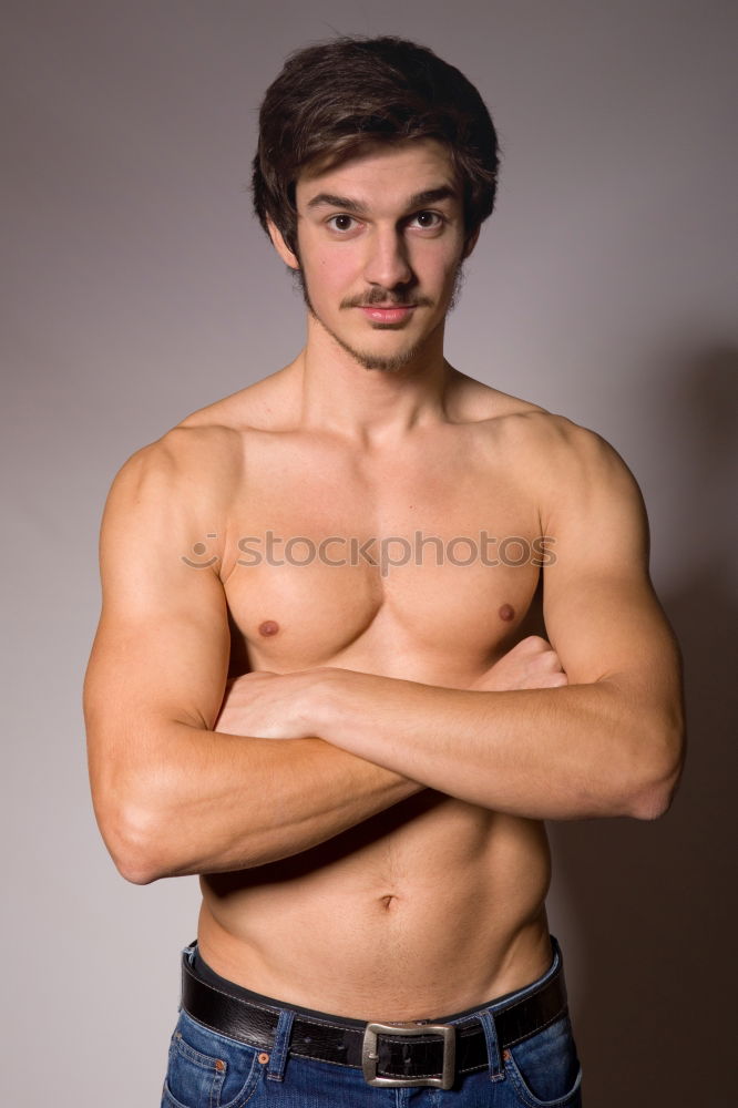 Similar – shirtless muscular man showing abs