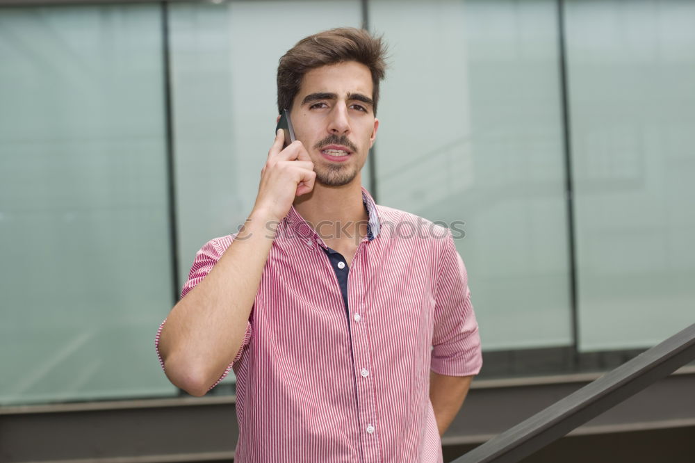 Similar – Young bearded man, model of fashion, in urban background wearing casual clothes while leaning on a wall and looking aside