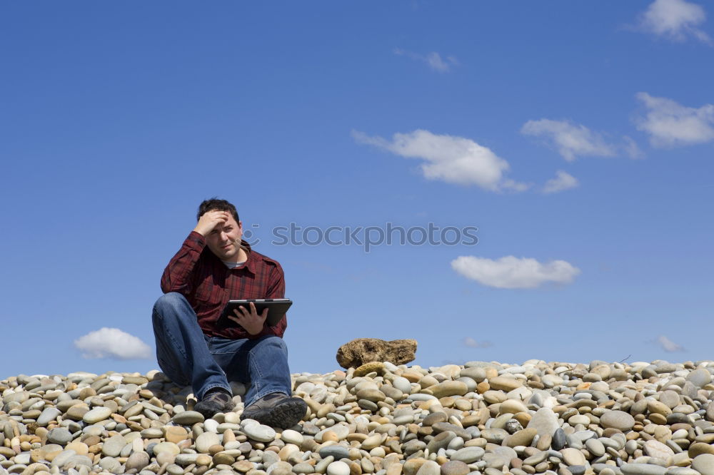 Similar – Man exhausted from a hike at a viewpoint