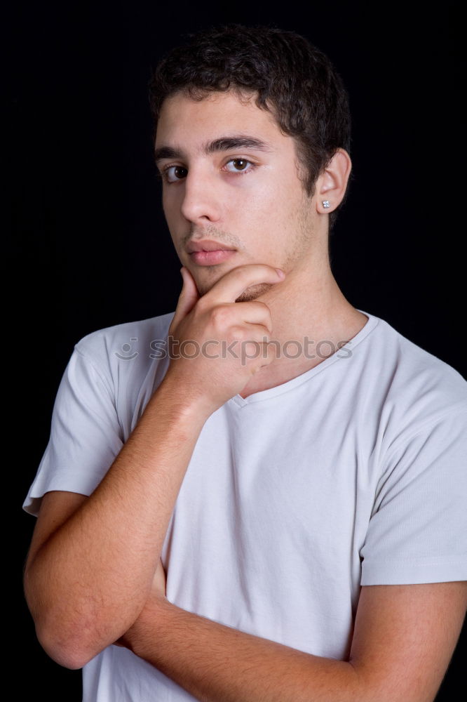 Serious teenager guy with hood on the head