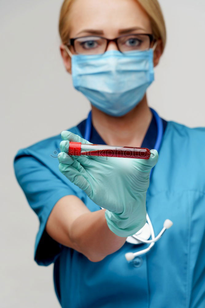 Similar – Image, Stock Photo Female doctor putting on her protective gloves