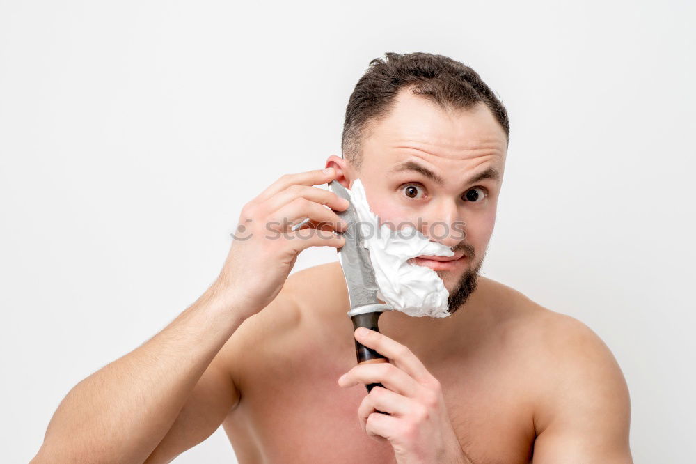 Similar – Young man applying shaving cream