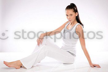 Similar – Image, Stock Photo Young sporty woman doing exercises with a latex band