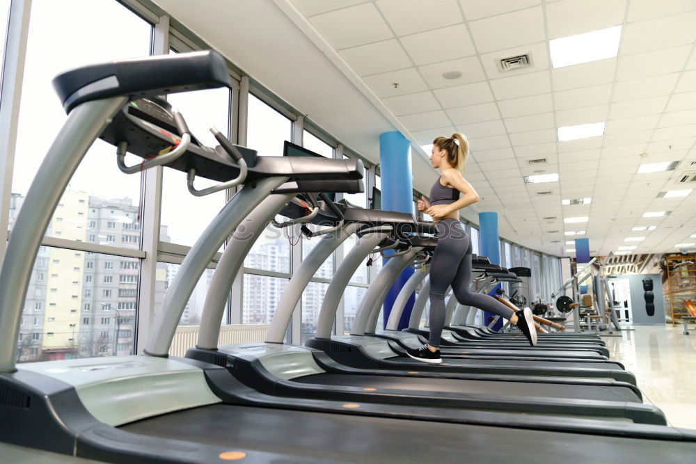 Similar – Image, Stock Photo People running over treadmill in a training session