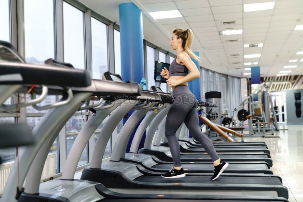 Similar – Image, Stock Photo People running over treadmill in a training session