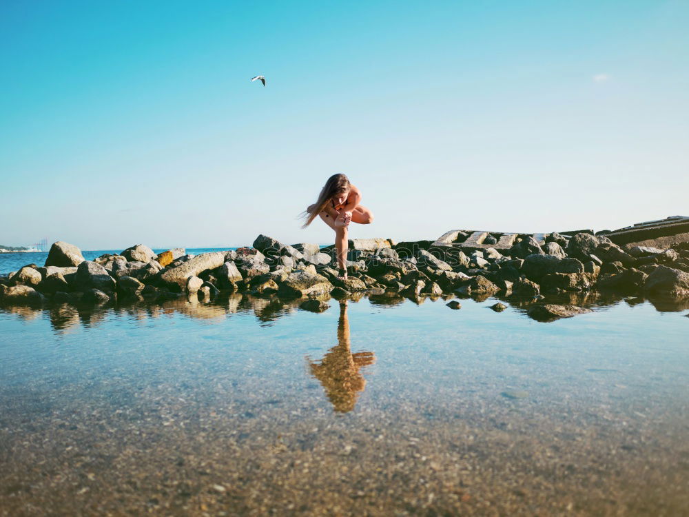 Similar – Image, Stock Photo Woman sitting at edge of rock