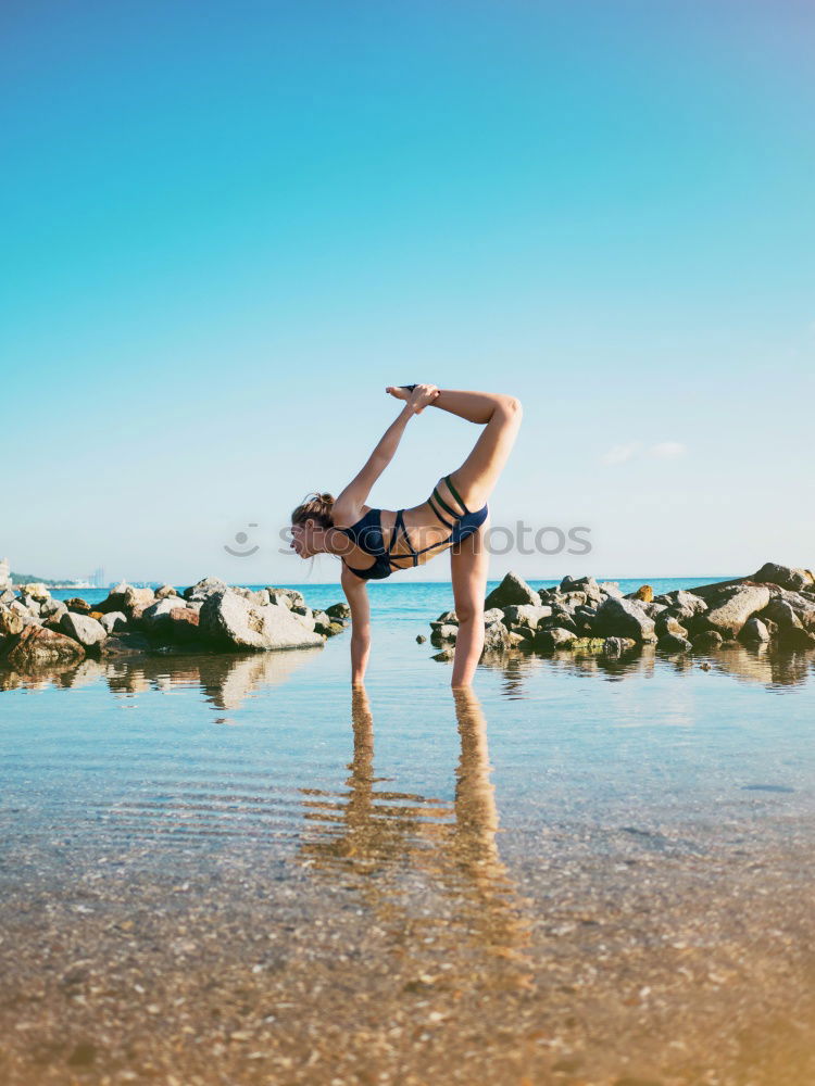 Similar – Image, Stock Photo Athletic man balancing on gymnastic rings