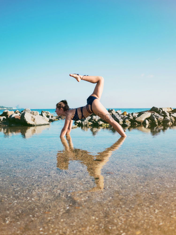 Similar – Image, Stock Photo Athletic man balancing on gymnastic rings