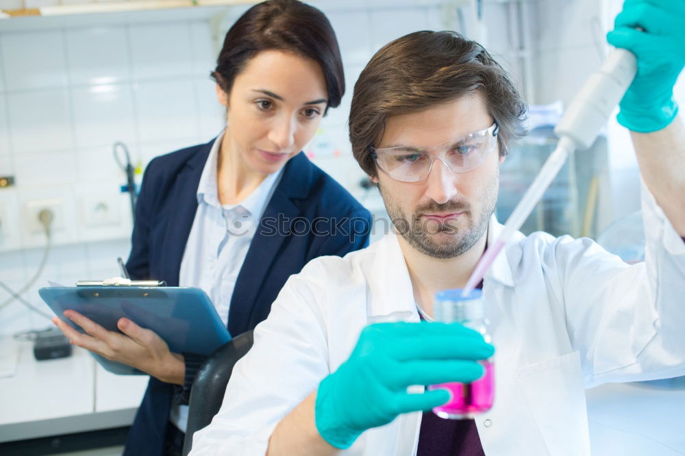 Similar – Image, Stock Photo People working with papers in lab