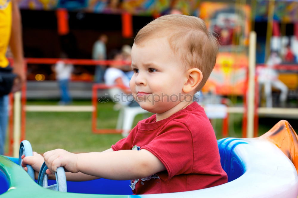 Similar – Image, Stock Photo Beautiful baby playing with her toys at carriage in a walk at park