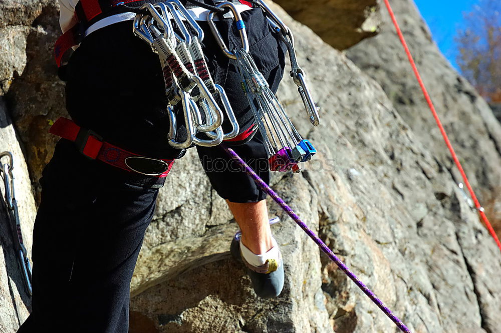 Similar – Image, Stock Photo Young climbers putting climbing shoes on