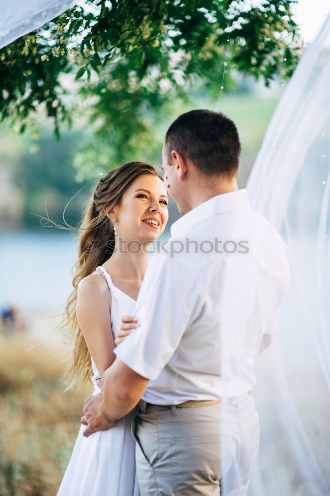 Similar – Image, Stock Photo Sensual wedding couple kissing on shoreline