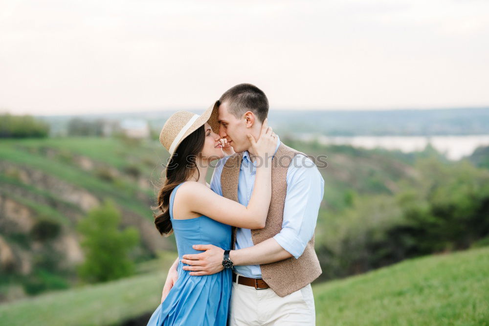 Similar – Image, Stock Photo Young loving couple hugging in the street.