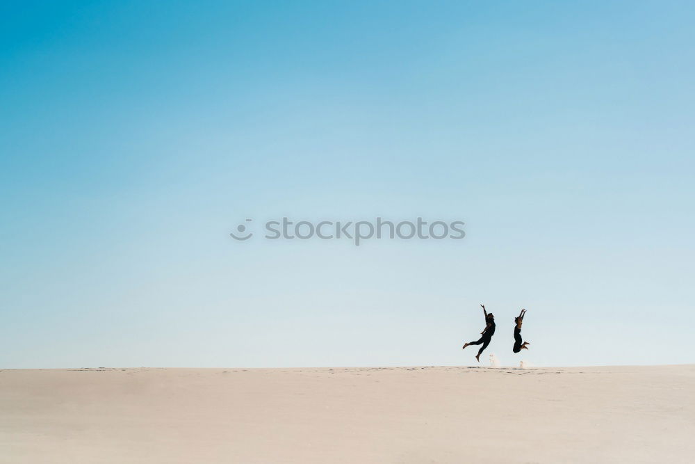 Similar – Image, Stock Photo Excited women lying on cliff