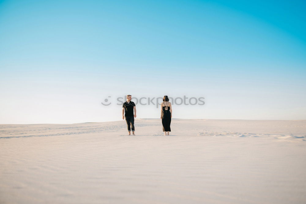 Similar – Image, Stock Photo Anonymous man walking on sand hills