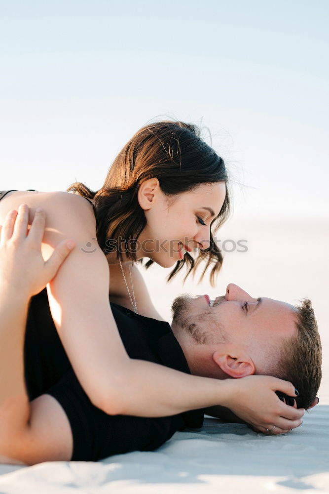 Similar – Image, Stock Photo Tender kissing bridal couple in sunlight