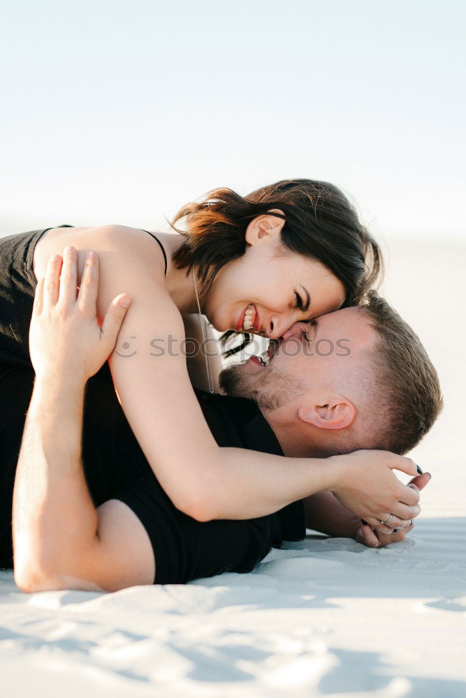 Similar – Image, Stock Photo Blonde woman and bearded man embracing and smiling together with a van in the background at sunset.